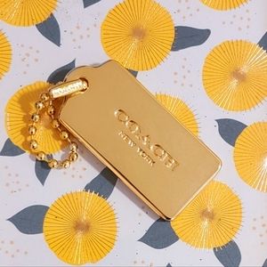 COACH-NEW LARGE GOLD PURSE TAG